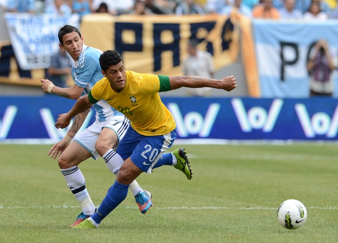 Argentine Player Angel Di Maria And Brazilian Player Hulk (20) Chase The Ball