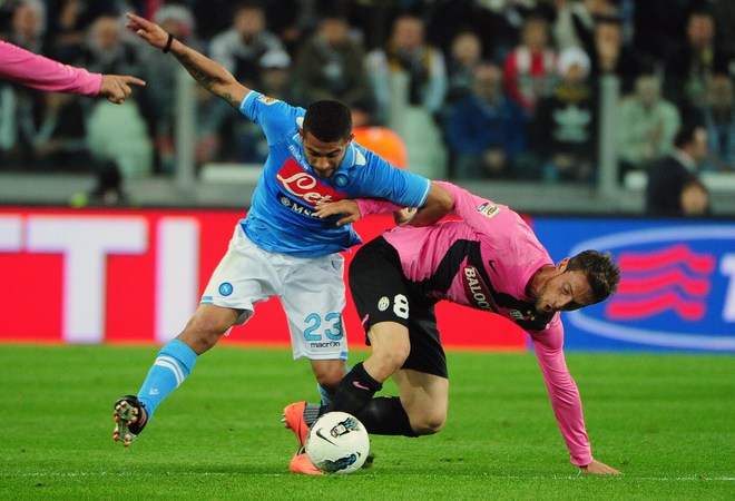 Juventus' Midfielder Claudio Marchisio (R) Fights For The Ball With Napoli's Huruguayan Midfielder Walter Alejandro