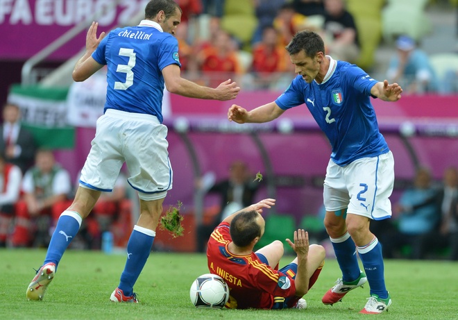 Spanish Midfielder Andres Iniesta (C) Vies With Italian Defender Giorgio Chiellini And Italian Defender Christian