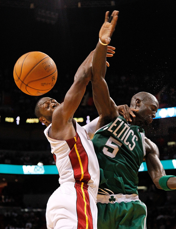  Dwyane Wade #3 Of The Miami Heat And Kevin Garnett #5 Of The Boston Celtics Fight For A Loose Ball