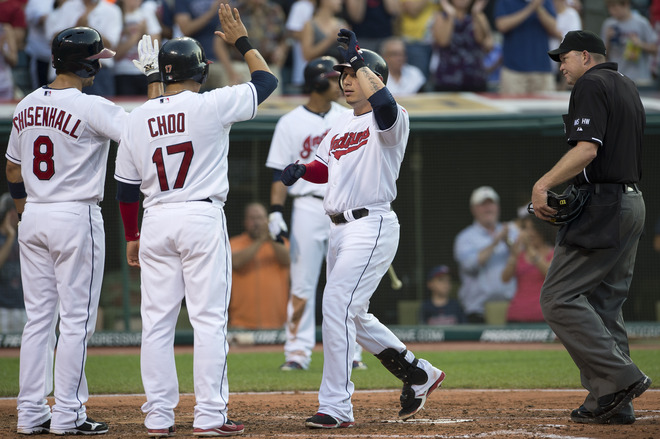  Lonnie Chisenhall #8 And Shin-Soo Choo #17 Celebrate With Asdrubal Cabrera #13 Of The Cleveland Indians