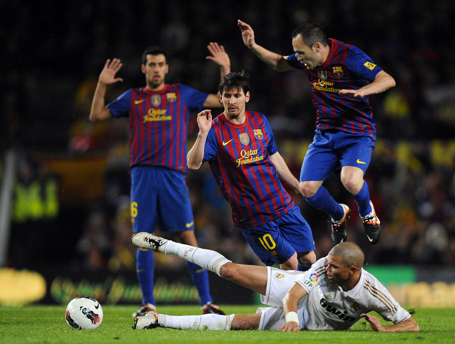   Andres Iniesta Of FC Barcelona (R) Lionel Messi Of FC Barcelona (C) Duels For The Ball With Pepe Of Real Madrid CF