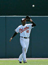 SARASOTA, FL - MARCH 24: Outfielder Adam Jones #10 of the Baltimore Orioles catches a fly ball against the Washington Nationals during a Grapefruit League Spring Training Game at Ed Smith Stadium on March 24, 2012 in Sarasota, Florida. (Photo by J. Meric/Getty Images)