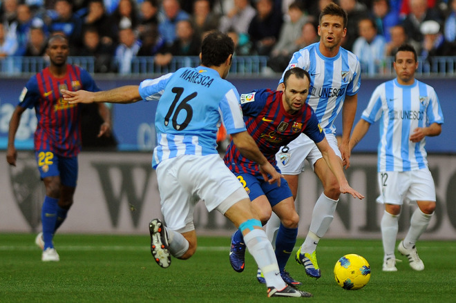 Malaga's Italian Midfielder Enzo Maresca (L) Vies