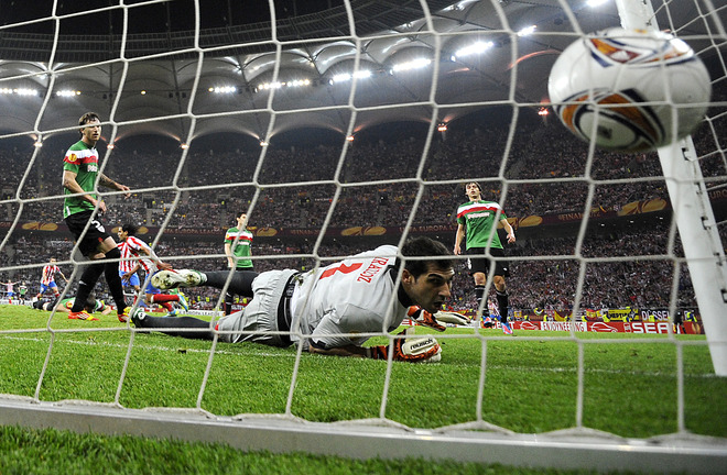 Athletic Bilbao's Goalkeeper Gorka Iraizoz Looks At The Ball Touching The Net As Atletico Madrid's Colombian Forward