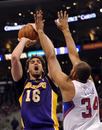 LOS ANGELES, CA - JANUARY 14:  Pau Gasol #16 of the Los Angeles Lakers takes a shot in front of Brian Cook #34 of the Los Angeles Clippers at Staples Center on January 14, 2012 in Los Angeles, California.  NOTE TO USER: User expressly acknowledges and agrees that, by downloading and/or using this Photograph, user is consenting to the terms and conditions of the Getty Images License Agreement.  (Photo by Harry How/Getty Images)