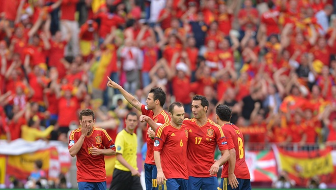 Spanish Forward Cesc Fabregas (C) Reacts