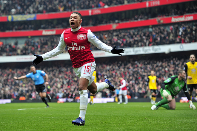 Arsenal's English Striker Alex Oxlade-Chamberlain Celebrates Scoring Their Third Goal   RESTRICTED TO EDITORIAL USE. No