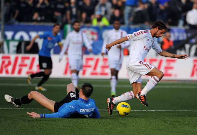 AC Milan's Defender Luca Antonini  (R) Fights