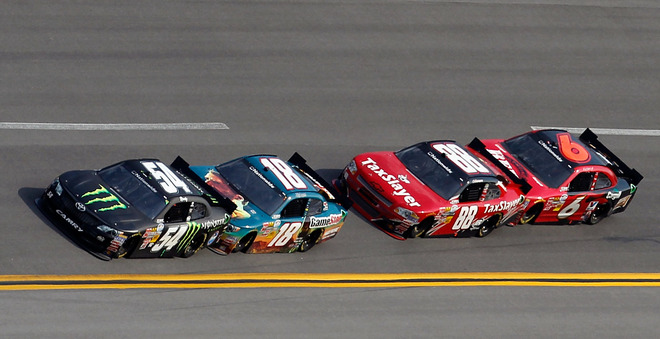 Kyle Busch Driver Of The 54 Monster Energy Toyota Leads Joey Logano