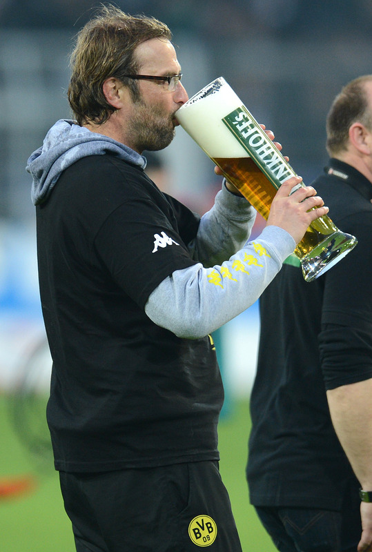 Dortmund's Head Coach Juergen Klopp Takes A Sip Of Beer AFP PHOTO / PATRIK STOLLARZRESTRICTIONS / EMBARGO - DFL