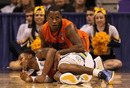 PHOENIX, AZ - MARCH 22:  Todd Mayo #4 of the Marquette Golden Eagles holds the ball as Erving Walker #11 of the Florida Gators goes after it in the second half during the 2012 NCAA Men's Basketball West Regional Semifinal game at US Airways Center on March 22, 2012 in Phoenix, Arizona.  (Photo by Jamie Squire/Getty Images)