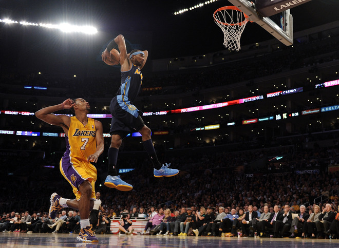   Corey Brewer #13 Of The Denver Nuggets Jumps To Dunk The Ball In Front Of Ramon Sessions #7 Of The Los Angeles Lakers