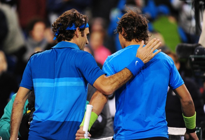 Roger Federer Of Switzerland (L) And Rafael Nadal Of Spain Walk Off The Court