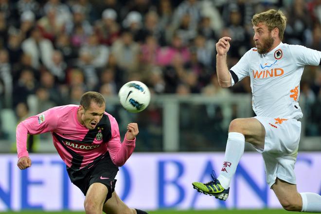 Juventus' Defender Giorgio Chiellini (L) Challenges