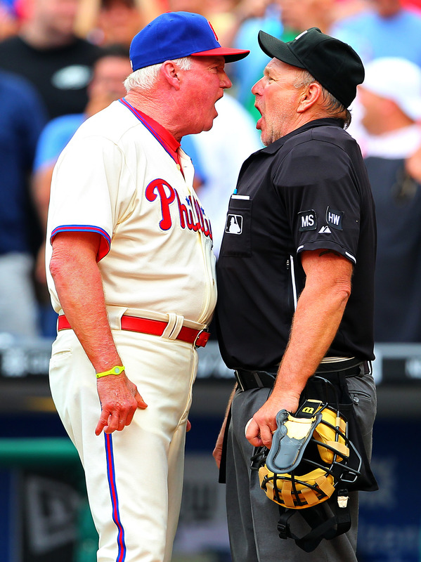  Manager Charlie Manuel #41 Of The Philadelphia Phillies Argues With Home Plate Umpire Bob Davidson On A Delayed Call