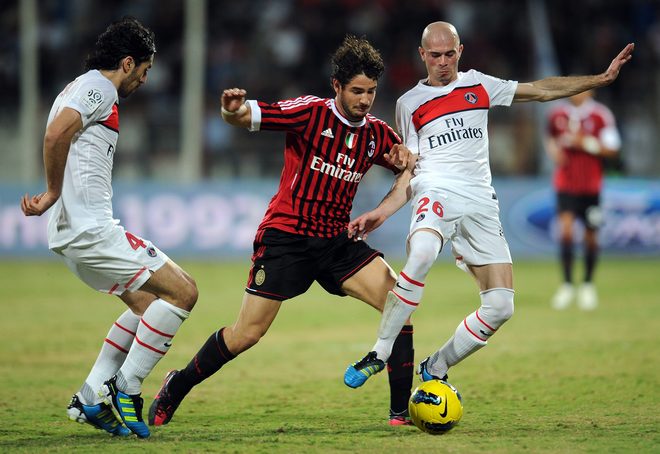 AC Milan's Brazilian Forward Robinho (C) Vies With Paris Saint-Germain's Defender Milan Bisevac (L) And Christophe