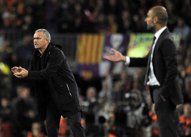 Real Madrid's Portuguese Coach Jose Mourinho (L) And Barcelona's Coach Josep Guardiola React