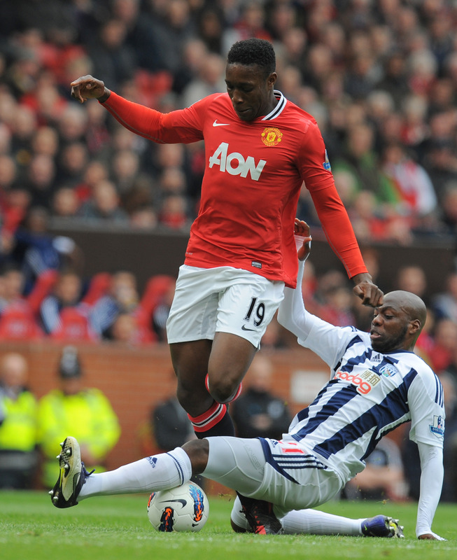 Manchester United's English Forward Danny Welbeck (L) Vies With West Bromwich Albion's Congolese Defender Youssuf