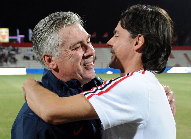 Paris Saint-Germain's Italian Coach Carlo Ancelotti (L) Hugs