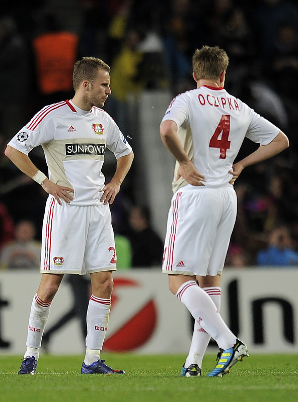 Leverkusen's Czech Defender Michal Kadlec (L) And Defender Bastian Oczipka (R) Gesture