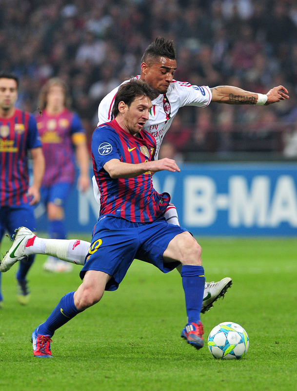 Barcelona's Argentinian Forward Lionel Messi (front) Fights For The Ball With AC Milan's Ghanaian Defender Prince Kevin