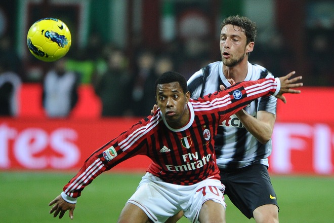 AC Milan's Brazilian Forward Robinho (L) Fights For The Ball With Juventus' Midfielder Claudio Marchisio On February 25,