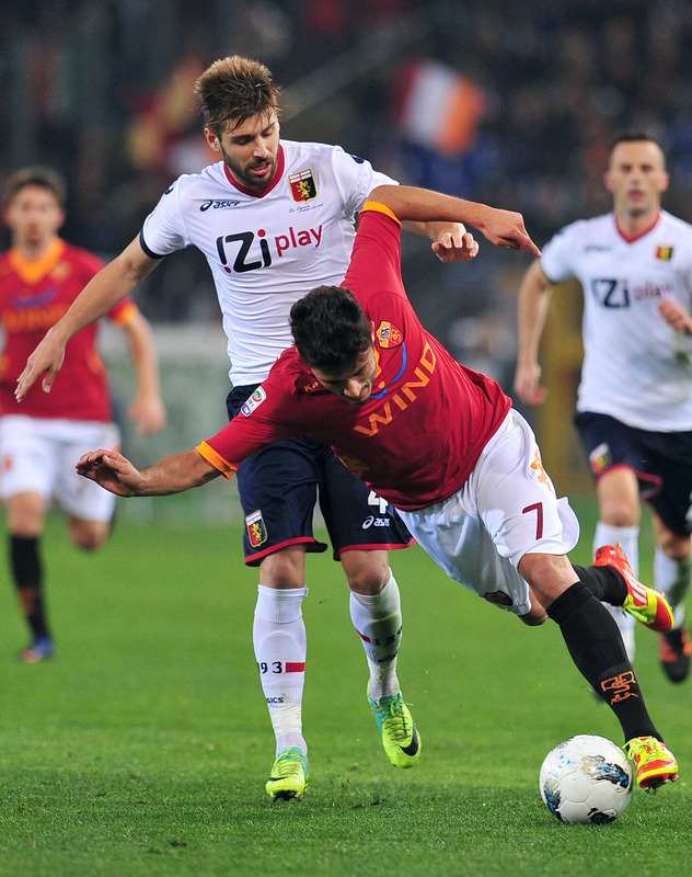 AS Roma's Brazilian Midfielder Marquinho (R) Fights For The Ball With Genoa's Portuguese Midfielder Miguel Veloso On