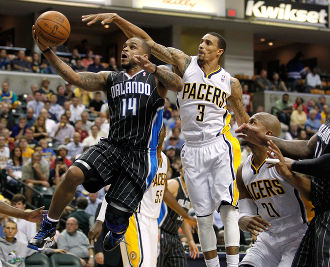  Jameer Nelson #14 Of The Orlando Magic Tries To Get A Shot Off Past George Hill #3 Of The Indiana Pacers In Game Five