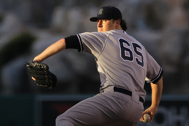   Phil Hughes #65 Of The New York Yankees Pitches