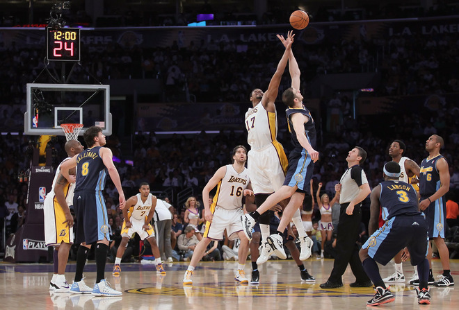   Andrew Bynum #17 Of The Los Angeles Lakers And Kosta Koufos #41 Of The Denver Nuggets Jump For The Opening Tip Off In