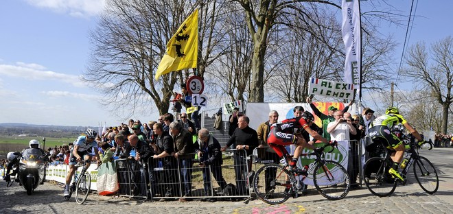 (L-R) Belgian Cyclist Tom Boonen (L) Of Team Omega Pharma-Quick Step, Italian Cyclist Alessandro Ballan (C) Of BMC