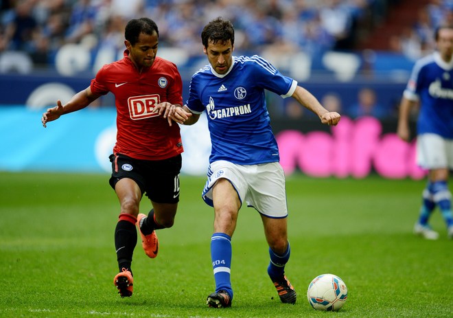 Hertha Berlin's Brazilian Midfielder Raffael (L) And Schalke's Spanish Striker Raul Vie For The Ball RESTRICTIONS /