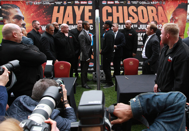 David Haye(2ndL) And Dereck Chisora Are Separated By A Fence As