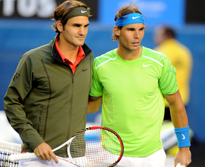 Roger Federer Of Switzerland (L) Poses