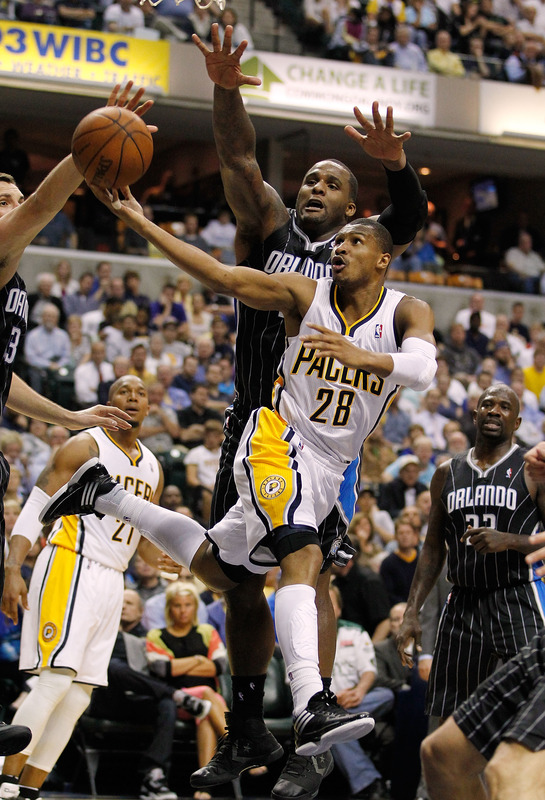  Leandro Barbosa #28 Of The Indiana Pacers Tries To Get A Shot Off Past Glen Davis #11 Of The Orlando Magic In Game Two