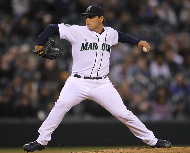   Starting Pitcher Jason Vargas #38 Of The Seattle Mariners Pitches