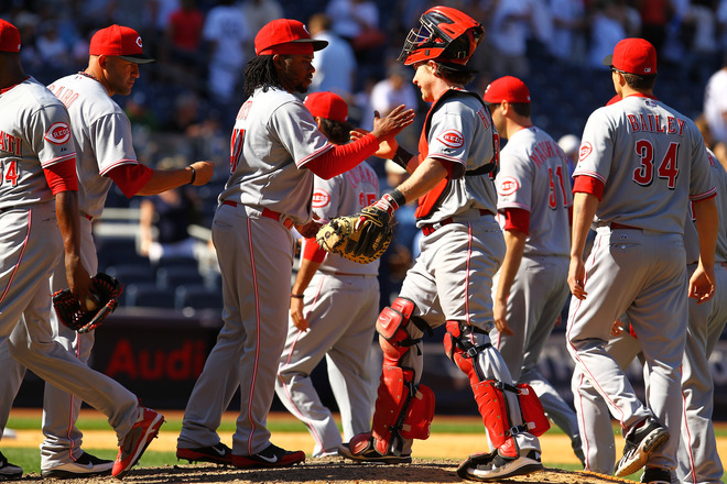  Johnny Cueto #47 Of The Cincinnati Reds And Ryan Hanigan #29 Celebrate Their 5-2 Win Against The New York Yankees