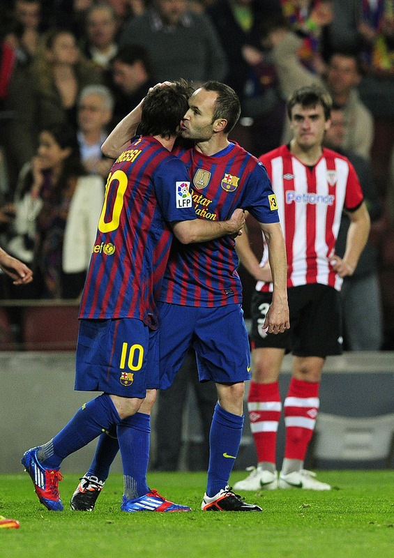 Barcelona's Midfielder Andres Iniesta (R) Is Congratuled By His Teammate Barcelona's Argentinian Forward Lionel Messi (