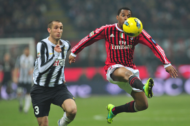 AC Milan's Brazilian Forward Robinho (R) Fights For The Ball With Juventus Defender Giorgio Chiellini On February 25,