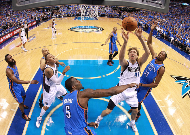   Dirk Nowitzki #41 Of The Dallas Mavericks Takes A Shot Against Kendrick Perkins #5 And Kevin Durant #35 Of The