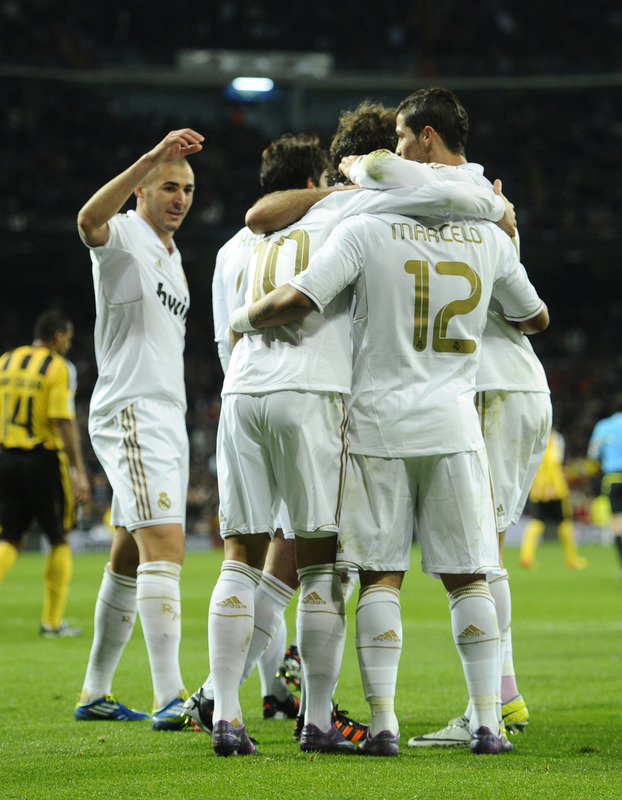 Real Madrid's German Midfielder Mesut Ozil (2L) Celebrates