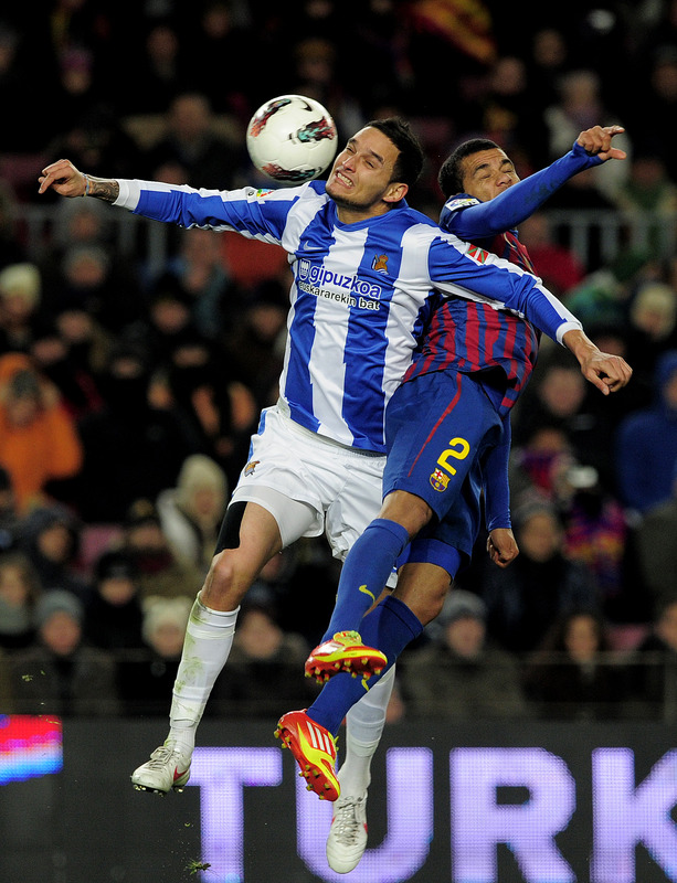 Real Sociedad's French Defender Liassine Cadamuro Betaiba (L) Vies With Barcelona's Brazilian Defender Daniel Alves (R)