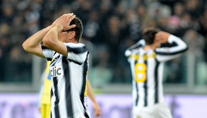 Juventus Midfielder Simone Padoin (L) Reacts