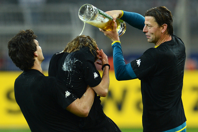 (LtoR) Dortmund's Defender Mats Hummels, Defender Marcel Schmelzer And Dortmund's Goalkeeper Roman Weidenfeller