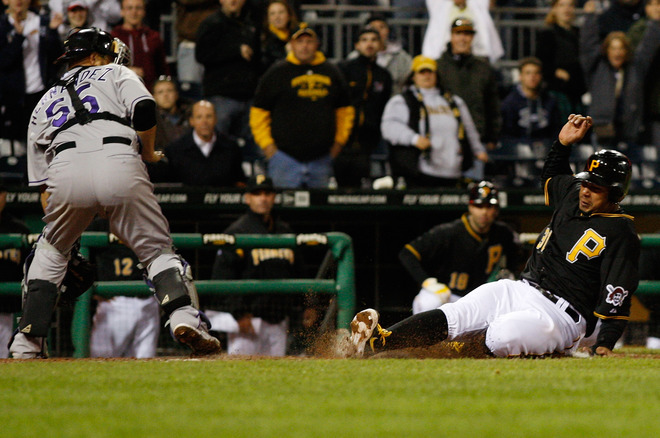   Jose Tabata #31 Of The Pittsburgh Pirates Slides Into Home Plate To Score The Tying Run In The 7th Inning Against The