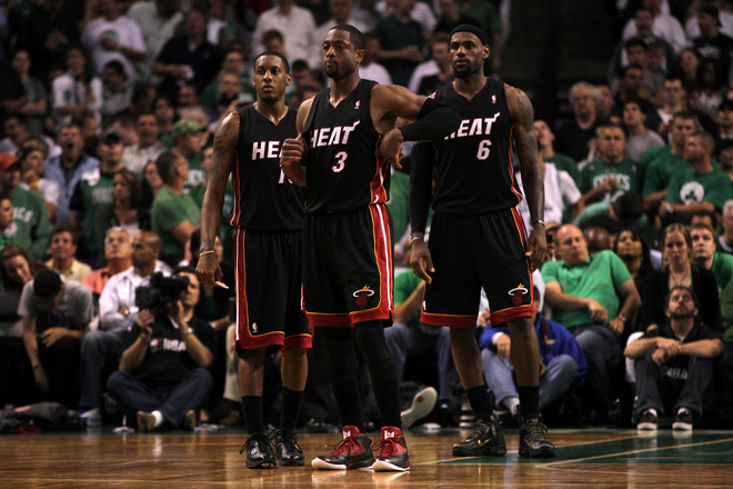   (L-R) Mario Chalmers #15, Dwyane Wade #3 And LeBron James #6 Of The Miami Heat Look On In The Second Half Against The