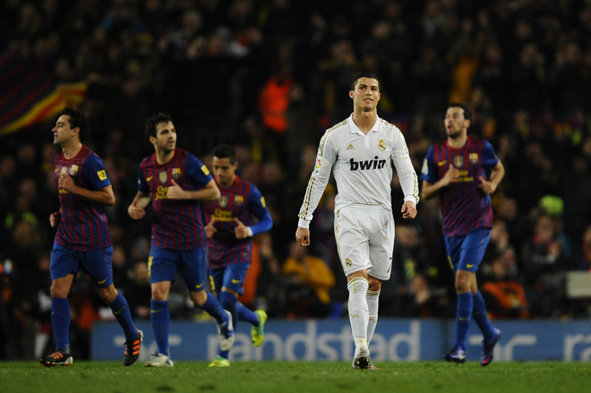  Cristiano Ronaldo Of Real Madrid  Walks Away From The FC Barelona Players As They Celebrate Their Team's Second Goal