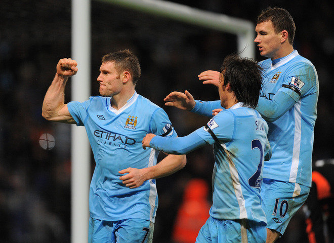 Manchester City's English Footballer James Milner (L) Celebrates RESTRICTED TO EDITORIAL USE. No Use With Unauthorized