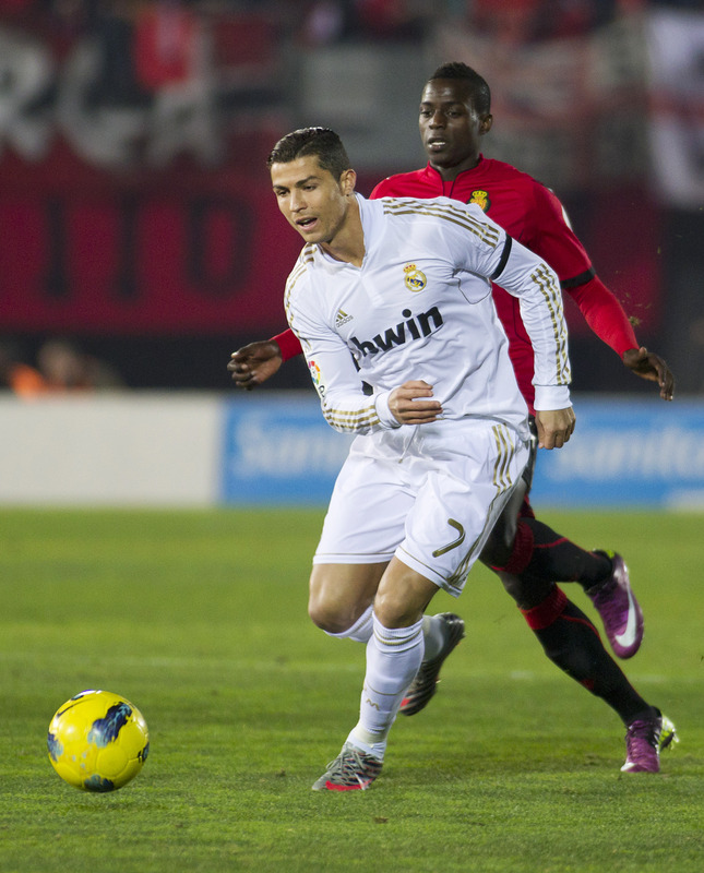 Real Madrid's Portuguese Forward Cristiano Ronaldo (L) Vies